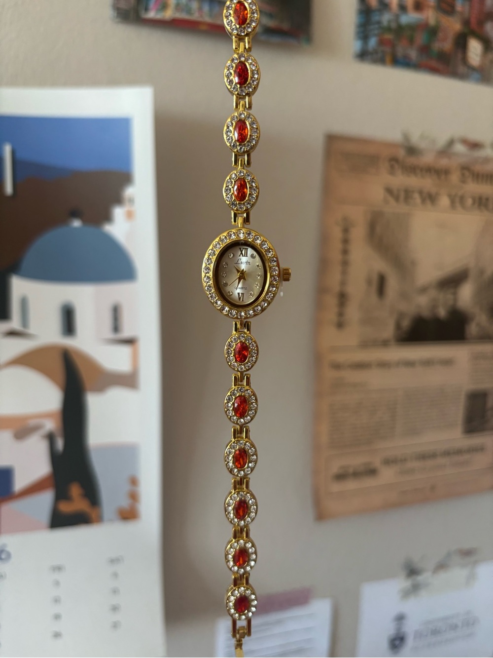 Gold-Tone Bracelet Watch with Red Gem Accents